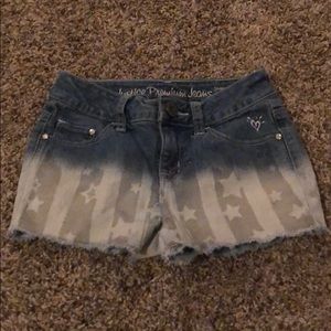 American flag in white and gray shorts